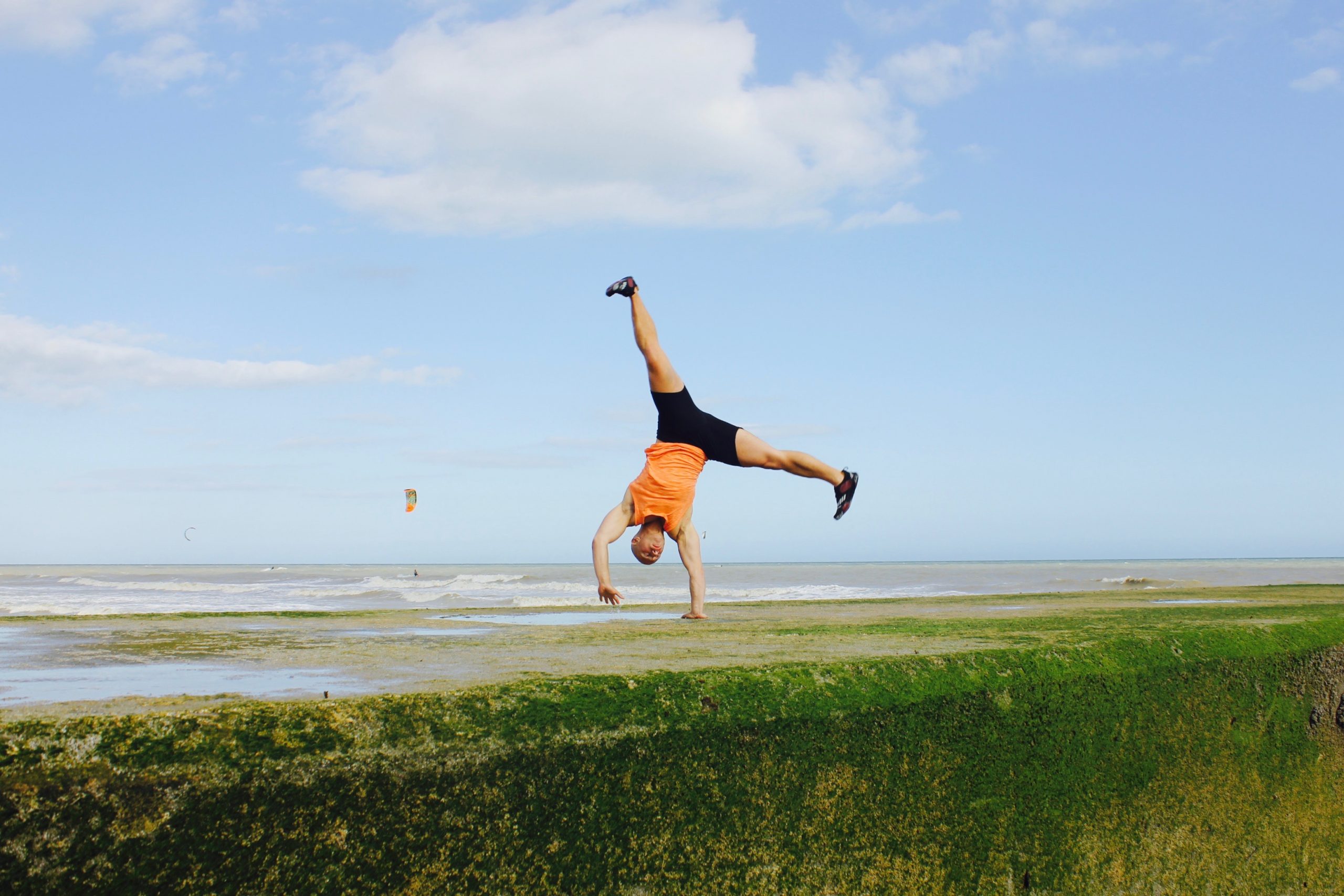 One arm handstand in beach